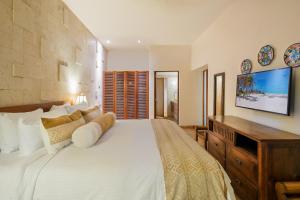 Un ou plusieurs lits dans un hébergement de l'établissement Porto Playa Condo Hotel and Beach Club