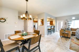 a dining room and living room with a table and chairs at Vistoso Resort Casita #136 in Oro Valley