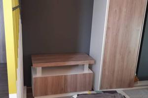 a wooden shelf in a room next to a door at departamento salta argentina in Salta +12 photos