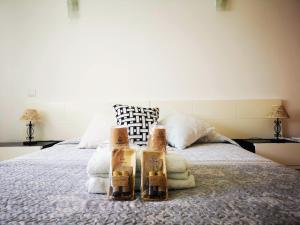 a bedroom with a bed with two boxes on it at Casa d'Avó Arlete in Lagos