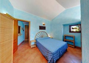 מיטה או מיטות בחדר ב-Residence Il Borgo di Porto Corallo