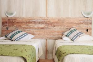 Voodi või voodid majutusasutuse Hostal Valle Mistral toas