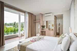 Postel nebo postele na pokoji v ubytování Svarga Resort Lombok + 37 fotografií