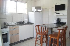 Una cocina o kitchenette en Pousada Vila dos Pescadores