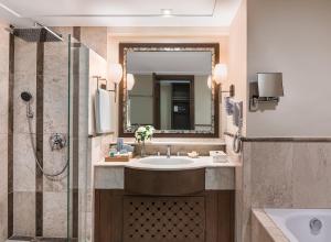 a bathroom with a sink and a shower at Henann Regency Resort and Spa in Boracay