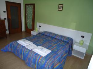 Postel nebo postele na pokoji v ubytování Spagna B&B