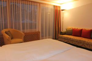 Voodi või voodid majutusasutuse Hotel Metropol & Spa Zermatt toas