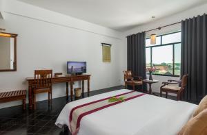 A television and/or entertainment centre at Kingdom Angkor Hotel