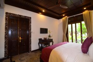 Voodi või voodid majutusasutuse Hoian Central Hotel toas