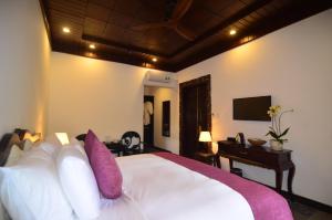 Voodi või voodid majutusasutuse Hoian Central Hotel toas