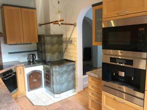 a kitchen with a stove and a dishwasher at Townville Chalet´s in Flachau +17 photos