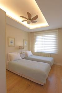 A bed or beds in a room at Cheya Sisli BNB Medical & Business City Center Tesvikiye Suites and Apartments