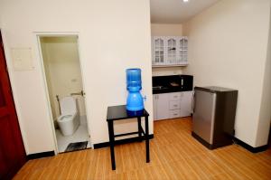 Η κουζίνα ή μικρή κουζίνα στο Tatay Seseng's Apartment