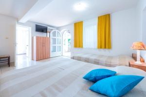 Posteľ alebo postele v izbe v ubytovaní Villa Carmen Rooms & Apartments