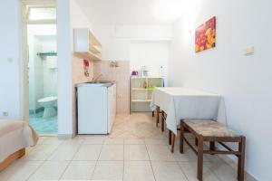 Kuchyňa alebo kuchynka v ubytovaní Villa Carmen Rooms & Apartments