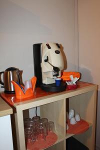 a table with a coffee maker on top of it at i 2 puttini in Catania