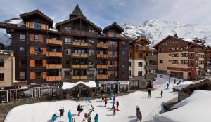 Το Appartement Prestige Manoir de Savoie - Arc 1950 le Village τον χειμώνα