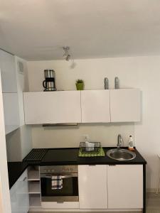 Kuchyňa alebo kuchynka v ubytovaní Apartamenty Bursztynowe w Kołobrzegu Sun&Relax