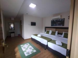 Postel nebo postele na pokoji v ubytování Yeob Bay hotel Ampang