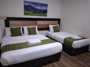 Postel nebo postele na pokoji v ubytování Yeob Bay hotel Ampang