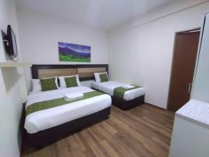 Postel nebo postele na pokoji v ubytování Yeob Bay hotel Ampang