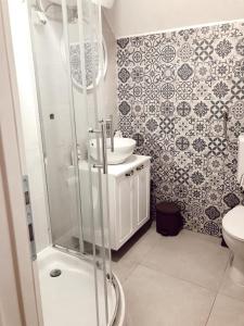 a bathroom with a shower and a sink at Vikendica Rita in Risovac +22 photos