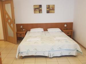 
Łóżko lub łóżka w pokoju w obiekcie Apartament w Kołobrzegu
