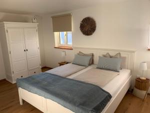 Postel nebo postele na pokoji v ubytování Logis 11 Apartments