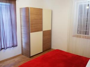 Posteľ alebo postele v izbe v ubytovaní Apartman Vlado