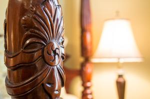 a close up of a wooden table with a lamp at Dundee Arms Inn in Charlottetown