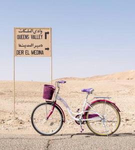 a bicycle parked on the side of a road at New Memnon Hotel in Luxor