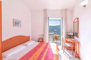 Postel nebo postele na pokoji v ubytování Hotel Citara