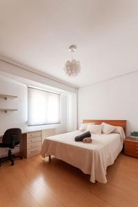 Katil atau katil-katil dalam bilik di Apartamentos El Llombo