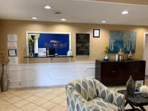 a salon with a waiting room with a chair and a counter at Baymont by Wyndham Eden in Eden