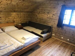 Voodi või voodid majutusasutuse Stubihuettn toas