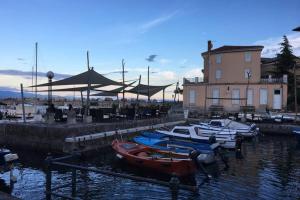 a group of boats are docked in a harbor at Apartman Volosko in Opatija