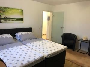 Ein Bett oder Betten in einem Zimmer der Unterkunft Apartment 1OG