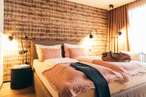 Ένα ή περισσότερα κρεβάτια σε δωμάτιο στο Boutique Hotel Das Rivus