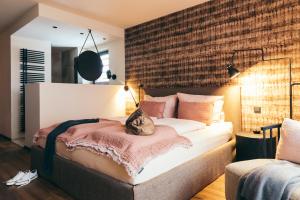 Ένα ή περισσότερα κρεβάτια σε δωμάτιο στο Boutique Hotel Das Rivus