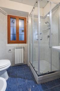 a bathroom with a shower and a toilet and a sink at Florence&Us Santa Croce in Florence