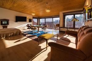 a living room with a couch and a table at Hotel No.16 in Bratislava