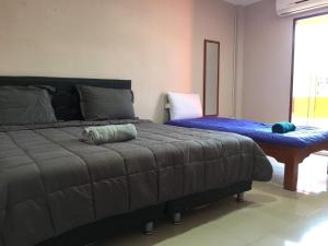 Postel nebo postele na pokoji v ubytování SMILE HOME GUESTHOUSE