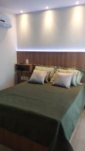 Postel nebo postele na pokoji v ubytování Apart Hotel Pedra Azul