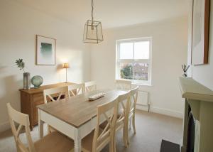 a kitchen and dining room with a table and chairs at Host & Stay - Osborne House in Whitby