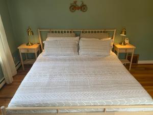 Voodi või voodid majutusasutuse Riverpath Inn toas