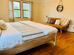 Voodi või voodid majutusasutuse Riverpath Inn toas