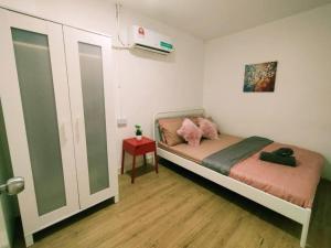 Postel nebo postele na pokoji v ubytování Malacca Jonkerhouse