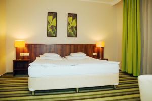 Postel nebo postele na pokoji v ubytování Hotel Ginkgo + 16 fotografií