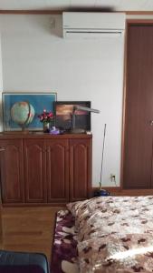 Postel nebo postele na pokoji v ubytování 町中ステイ 宗ハウス