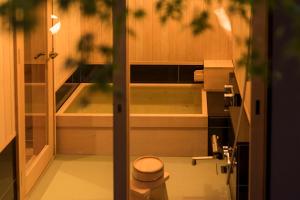 a small bathroom with a toilet in a room at Campton Nishijin Vacation Rental in Kyoto
